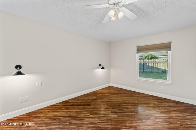 spare room with a textured ceiling, wood-type flooring, and ceiling fan