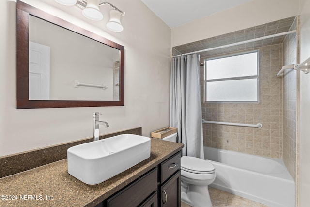 full bathroom with vanity, shower / bath combo, toilet, and tile patterned flooring