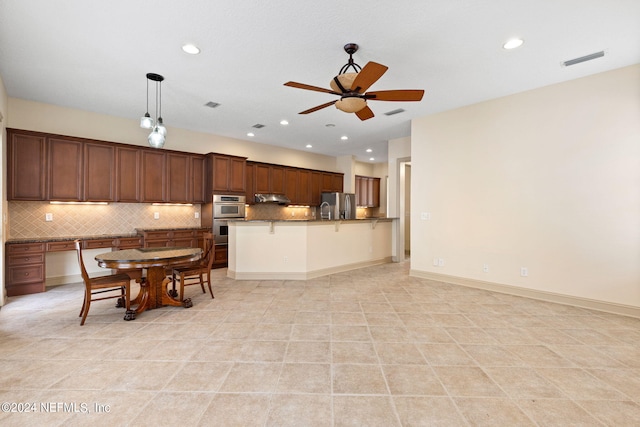 kitchen featuring ceiling fan, pendant lighting, light tile patterned floors, backsplash, and stainless steel appliances