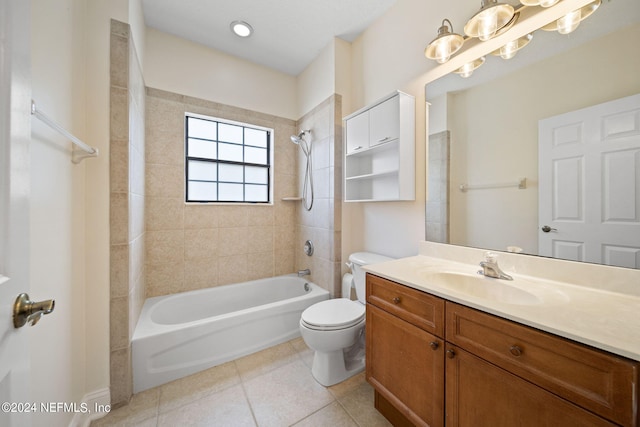 full bathroom with tiled shower / bath, vanity, toilet, and tile patterned floors