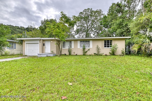 single story home with a front lawn and a garage