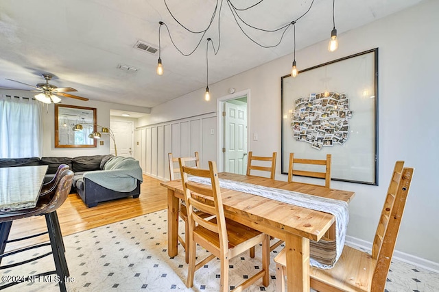 dining room with ceiling fan and light hardwood / wood-style flooring