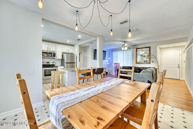 dining area featuring ceiling fan and light hardwood / wood-style flooring