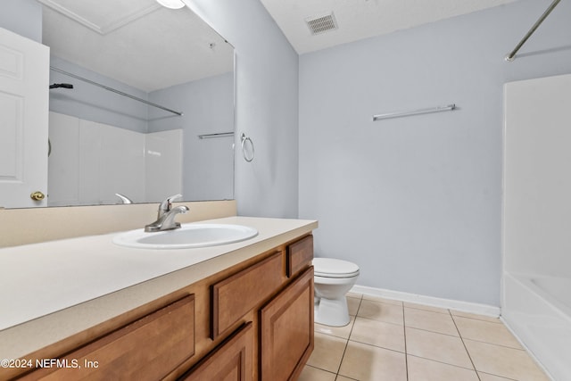 full bathroom with tile patterned floors, shower / bathtub combination, vanity, and toilet