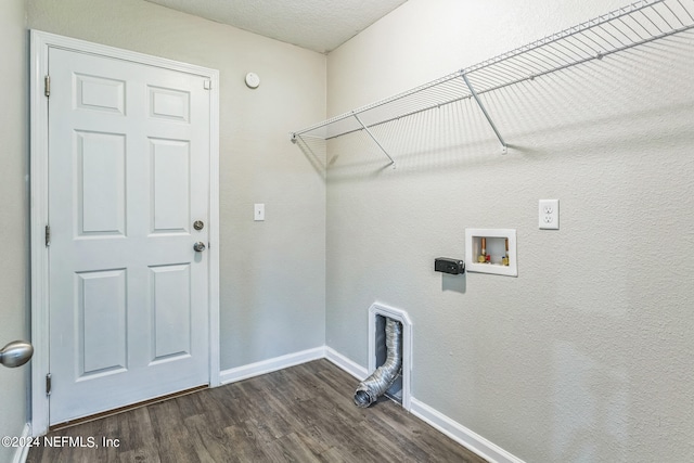 laundry room featuring washer hookup, a textured ceiling, and dark hardwood / wood-style flooring