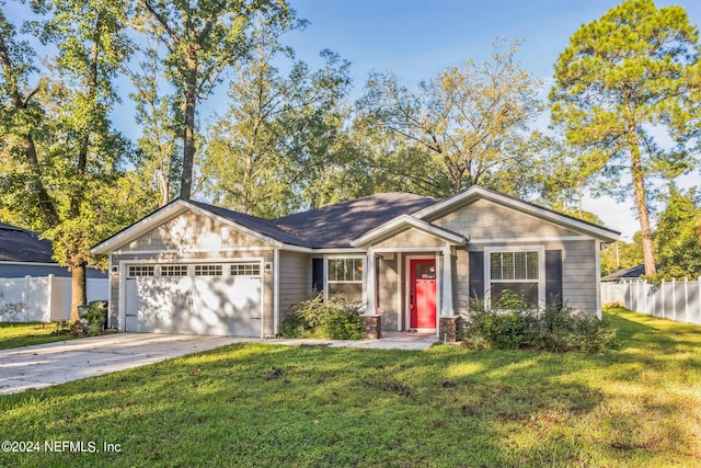 ranch-style house featuring a garage and a front lawn