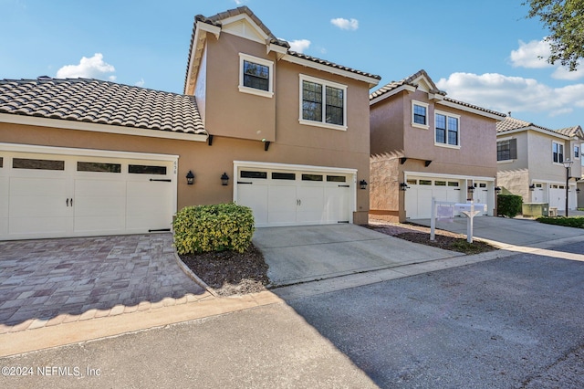 view of front of property with a garage