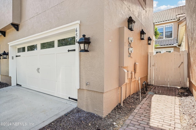 view of side of home with a garage