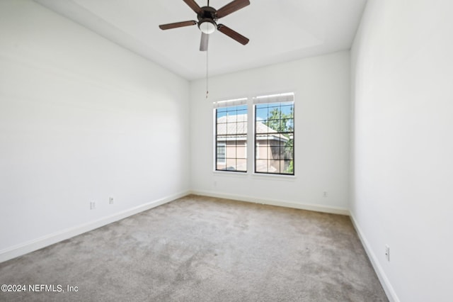 unfurnished room featuring ceiling fan and carpet floors