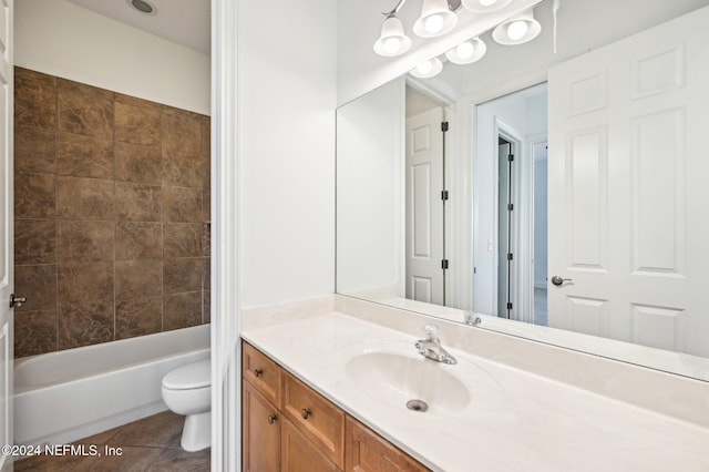 full bathroom featuring vanity, bathing tub / shower combination, toilet, and tile patterned flooring