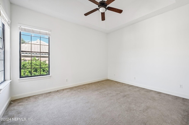 carpeted empty room with ceiling fan