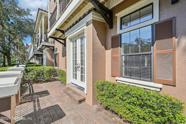 doorway to property featuring french doors and a balcony