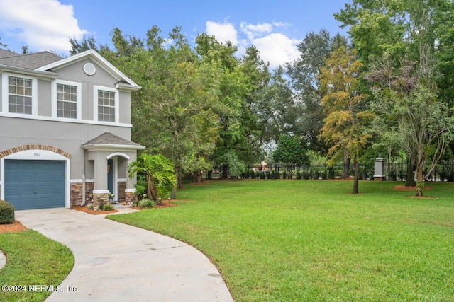 view of front facade with a garage and a front yard