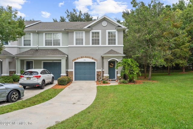 view of front facade featuring a front lawn and a garage