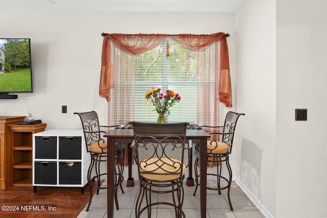 dining space with tile patterned flooring