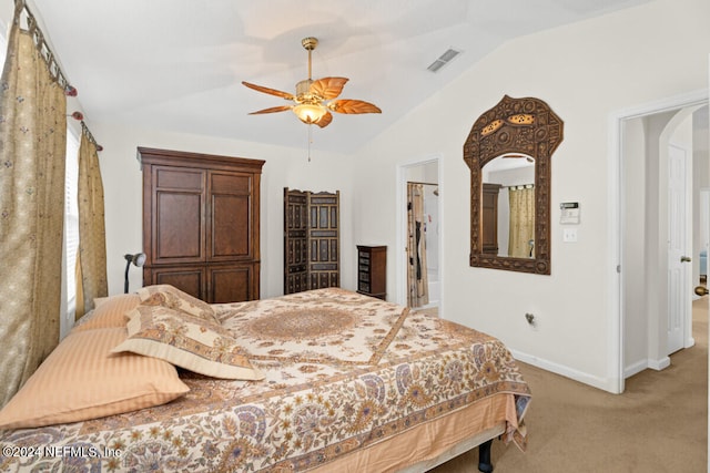 carpeted bedroom featuring vaulted ceiling and ceiling fan