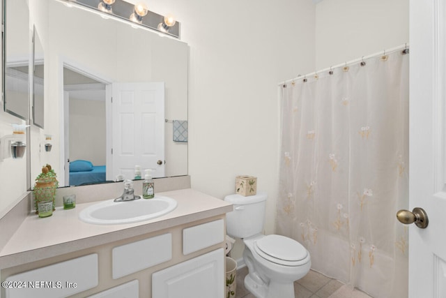 full bathroom featuring shower / bathtub combination with curtain, tile patterned floors, vanity, and toilet