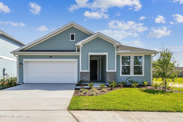 75582 Banyan Way, Yulee, FL 32097 - view of front of property with concrete driveway, a front lawn, and a garage
