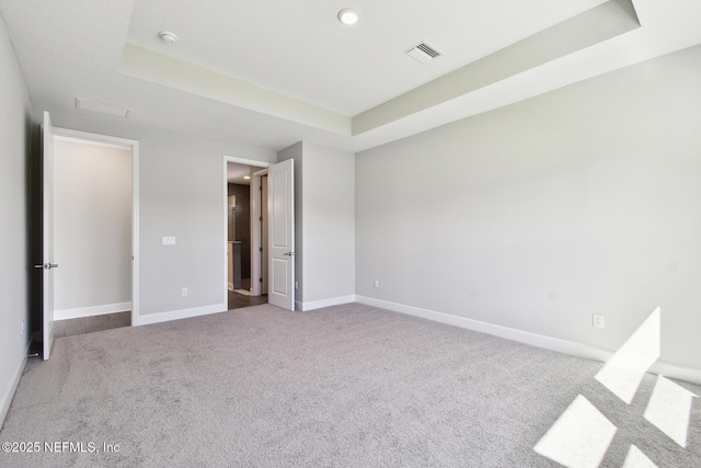 75582 Banyan Way, Yulee, FL 32097 - unfurnished bedroom featuring a raised ceiling, carpet flooring, baseboards, and recessed lighting