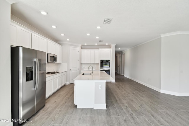 75582 Banyan Way, Yulee, FL 32097 - kitchen featuring stainless steel appliances, a sink, crown molding, recessed lighting, and decorative backsplash