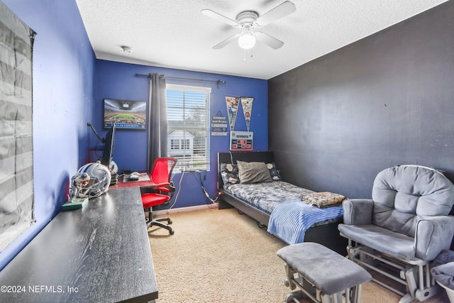 carpeted bedroom with a textured ceiling and ceiling fan