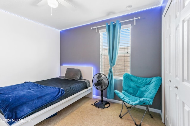 bedroom with carpet floors, a closet, and ceiling fan