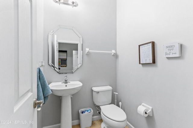 bathroom featuring sink and toilet