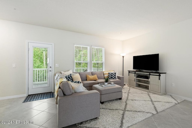 tiled living room with a wealth of natural light