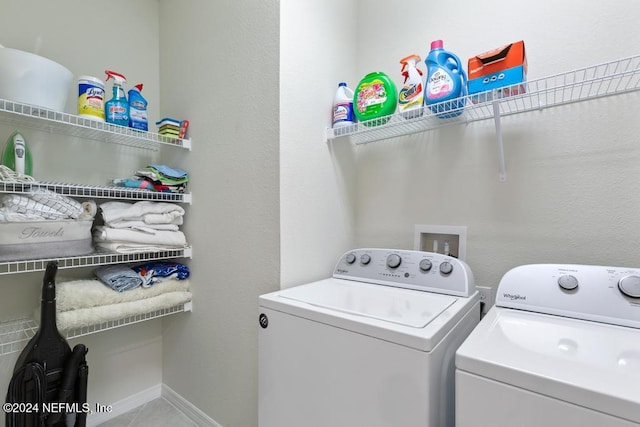 clothes washing area with independent washer and dryer