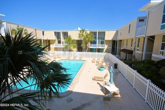 view of swimming pool with a patio area