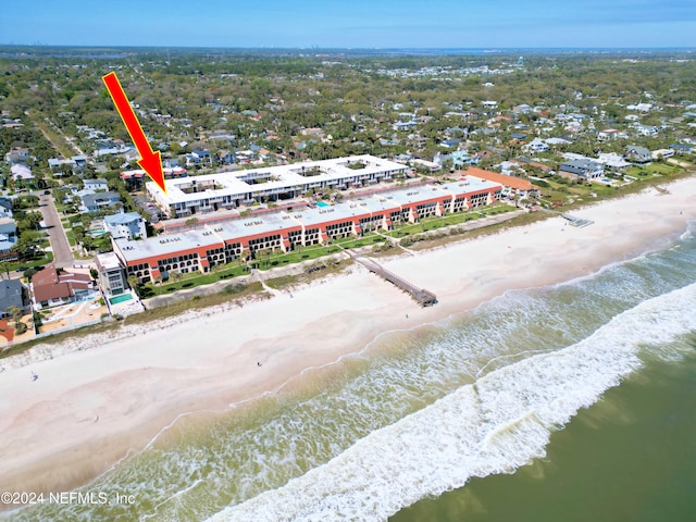 birds eye view of property featuring a view of the beach and a water view