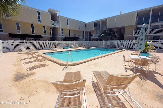 view of pool featuring a patio area