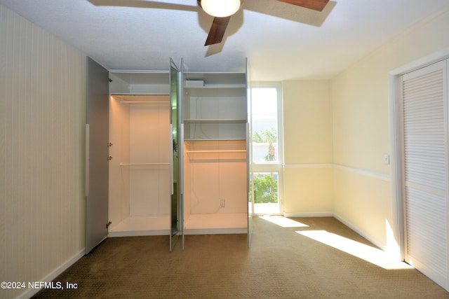 unfurnished bedroom with carpet floors and ceiling fan