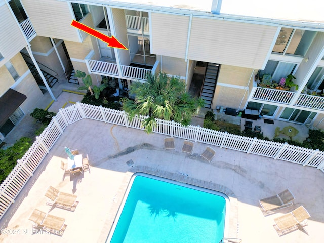 view of swimming pool featuring a patio area