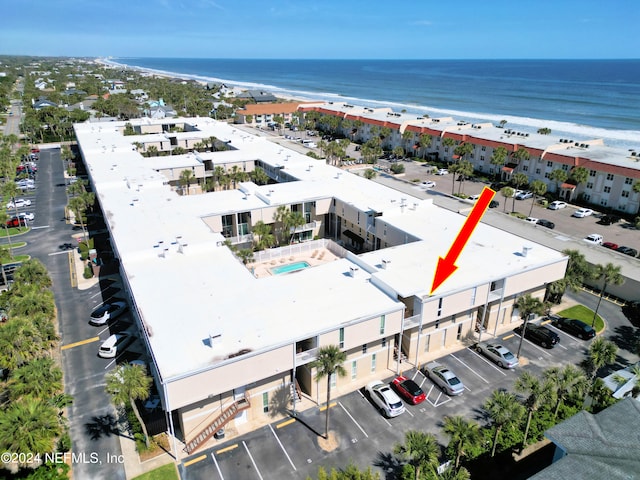 aerial view with a beach view and a water view