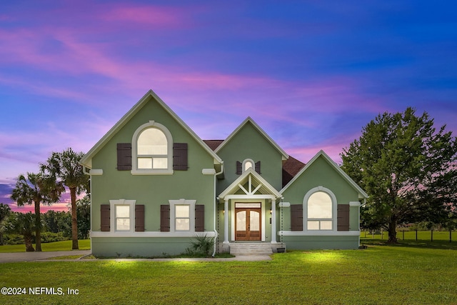 view of front of home with a lawn