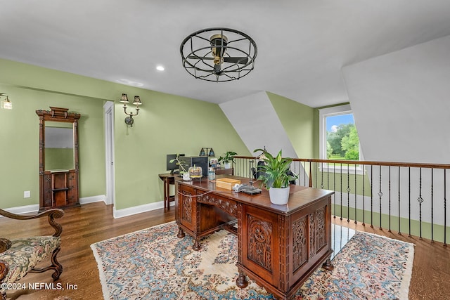 home office featuring vaulted ceiling, hardwood / wood-style flooring, and ceiling fan