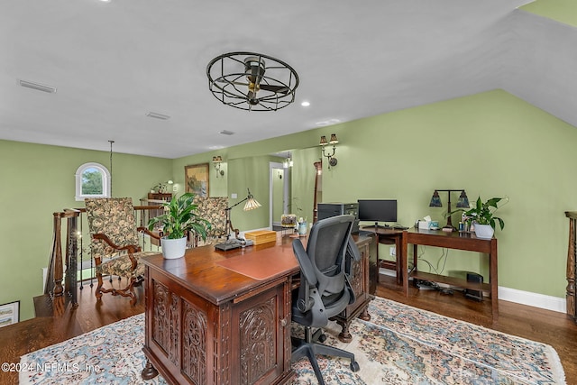 office space featuring lofted ceiling, ceiling fan, and dark hardwood / wood-style flooring