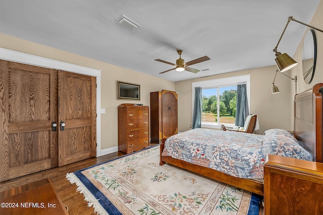 bedroom featuring ceiling fan and dark hardwood / wood-style flooring