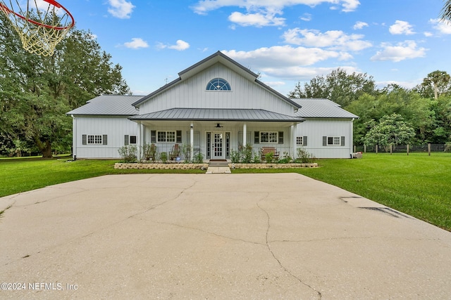 view of front of house with a front yard and a porch