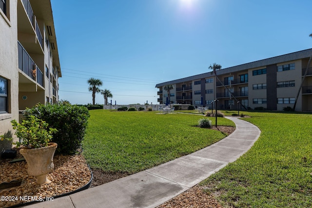 surrounding community featuring a lawn