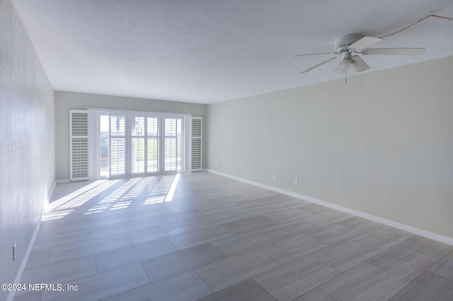 unfurnished room with ceiling fan