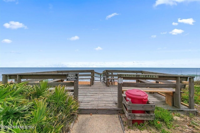 wooden terrace with a water view