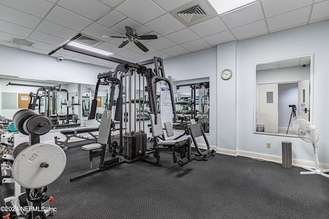 workout area featuring a drop ceiling and ceiling fan