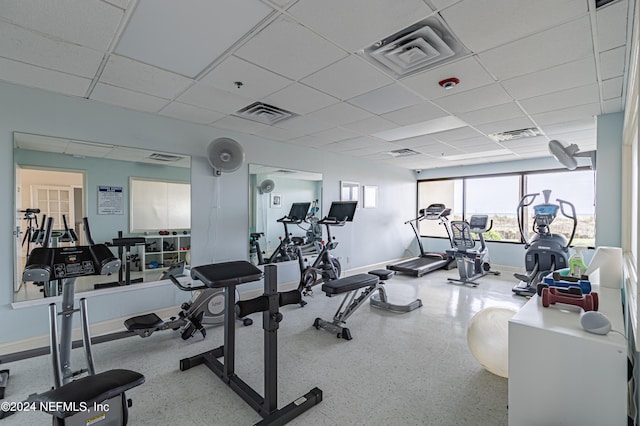 exercise room featuring a paneled ceiling