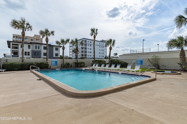 view of swimming pool featuring a patio