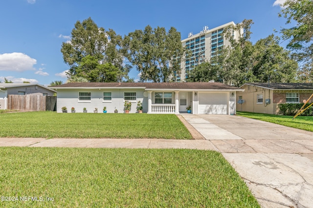 ranch-style house featuring a garage and a front lawn