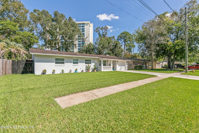 ranch-style house with a front lawn