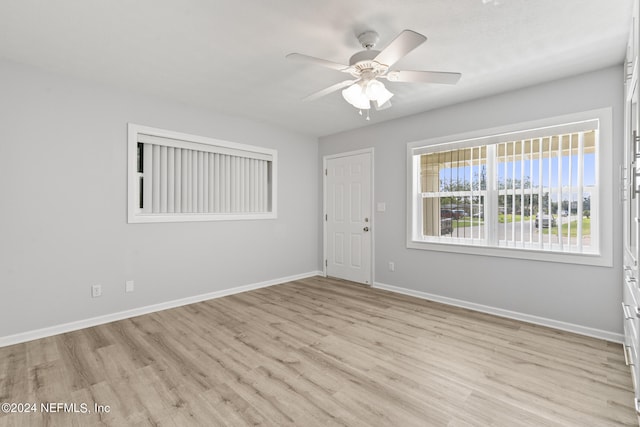 unfurnished room featuring light hardwood / wood-style flooring and ceiling fan