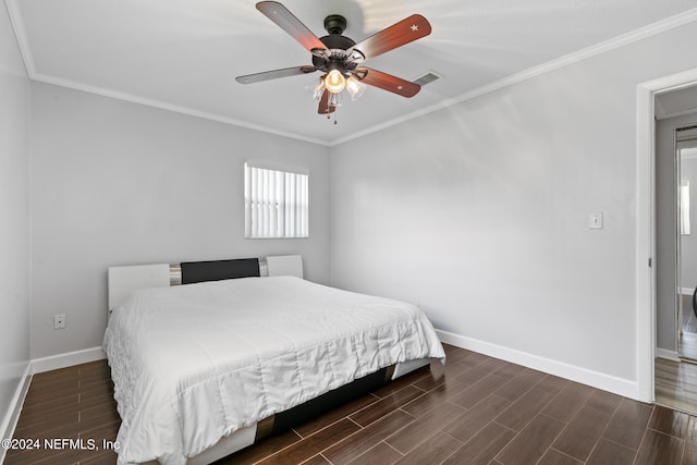 bedroom featuring ceiling fan, dark hardwood / wood-style floors, and ornamental molding